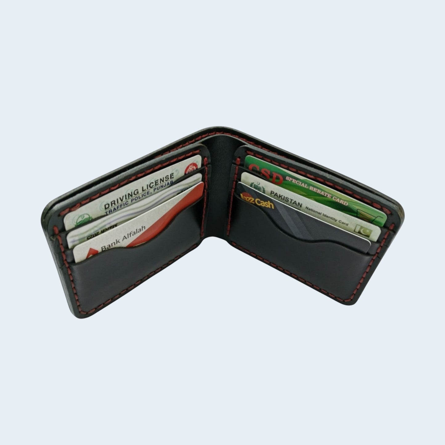 U&E Leather handcrafted black bifold wallet with red hand-stitched detailing and multiple card slots.
