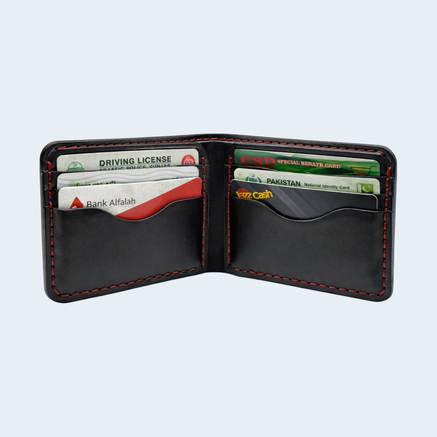U&E Leather handcrafted black leather bifold wallet with red hand-stitched detailing and multiple card slots.