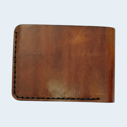 U&E Leather handcrafted brown bifold wallet with visible hand-stitched edges and premium genuine leather texture.